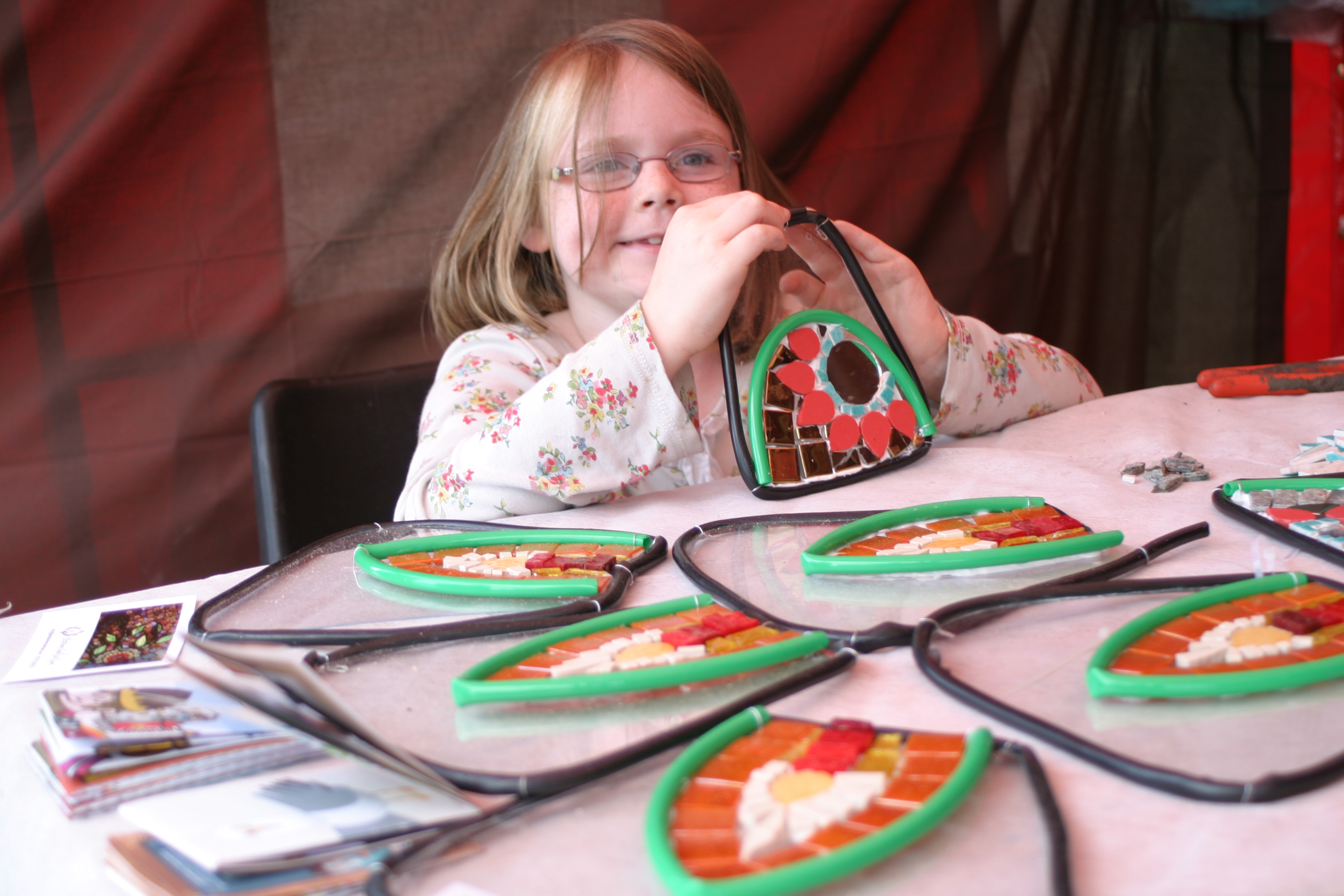 girl making a costume with mosaics