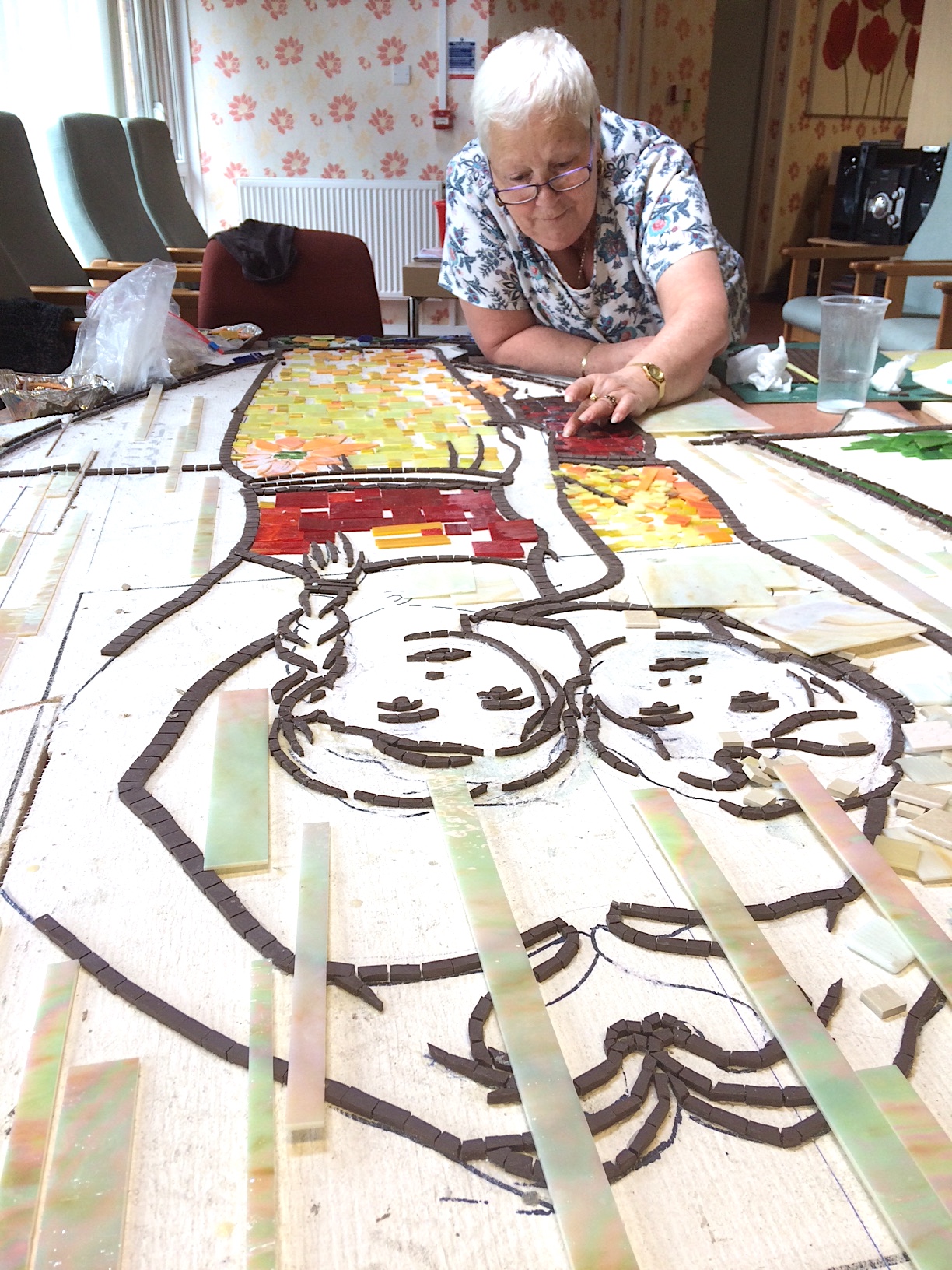 lady making a mosaic 