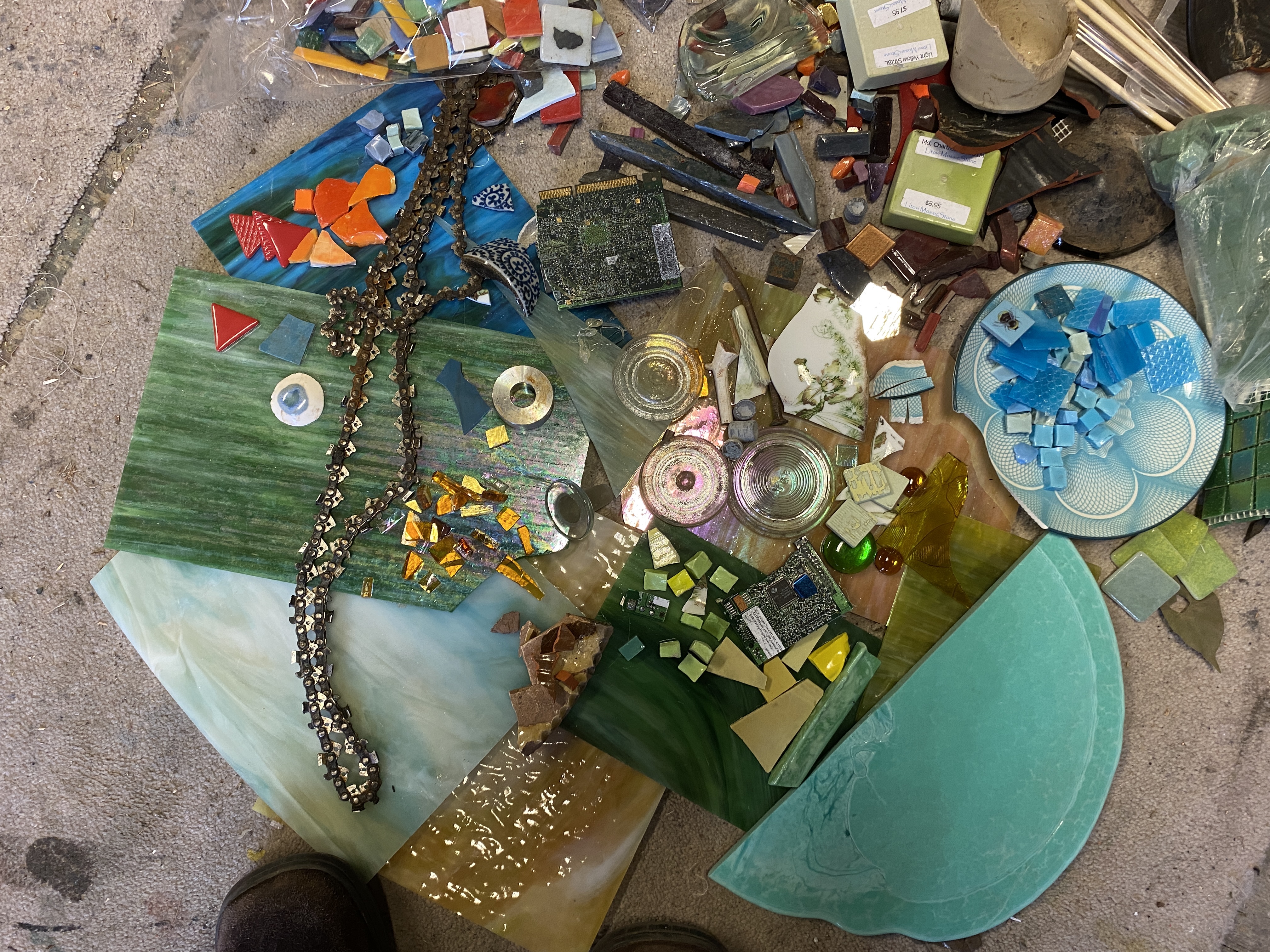 a mix of materials for sculpture, tiles and found objects pottery