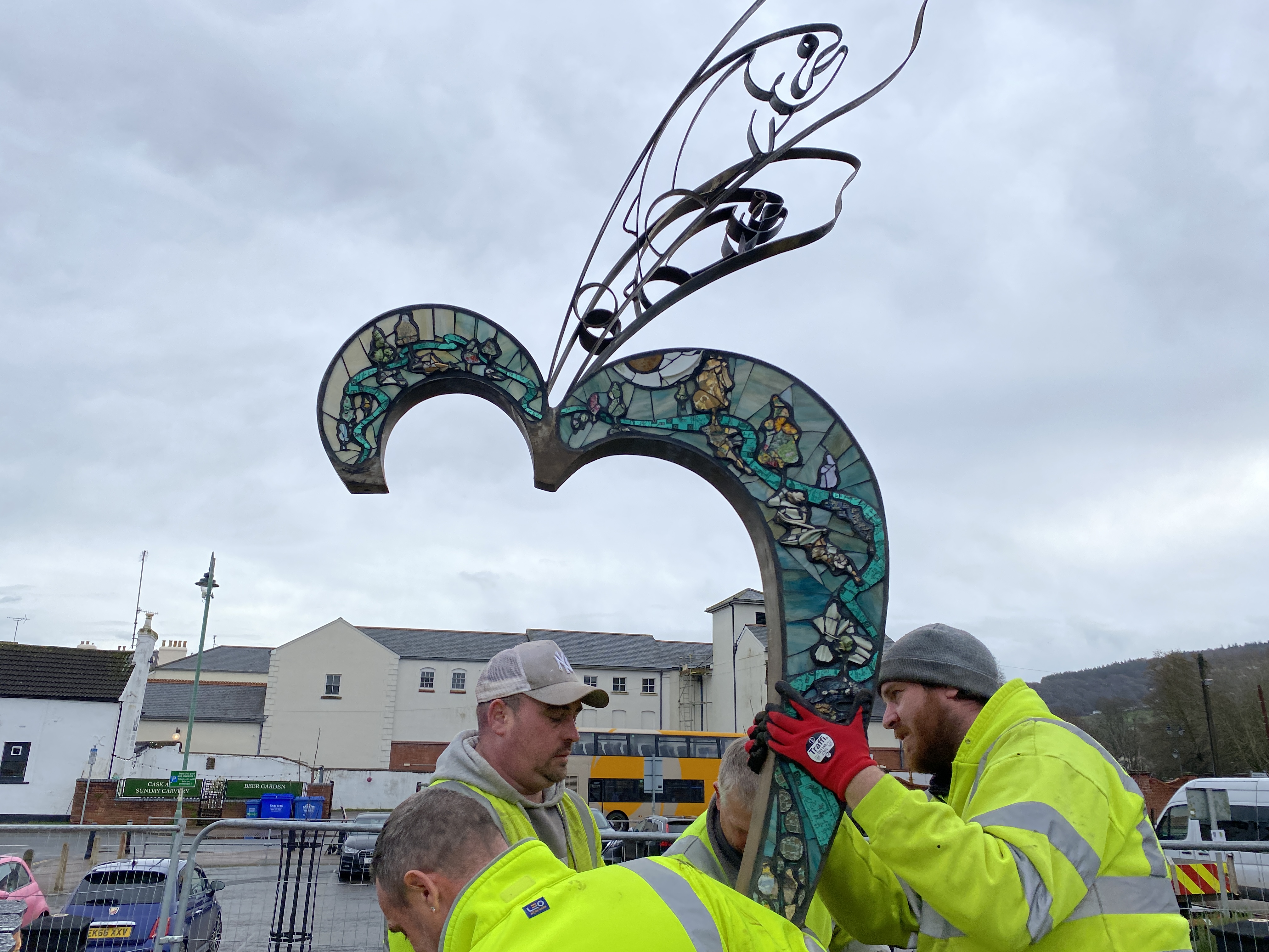 work men installing a mosaic 