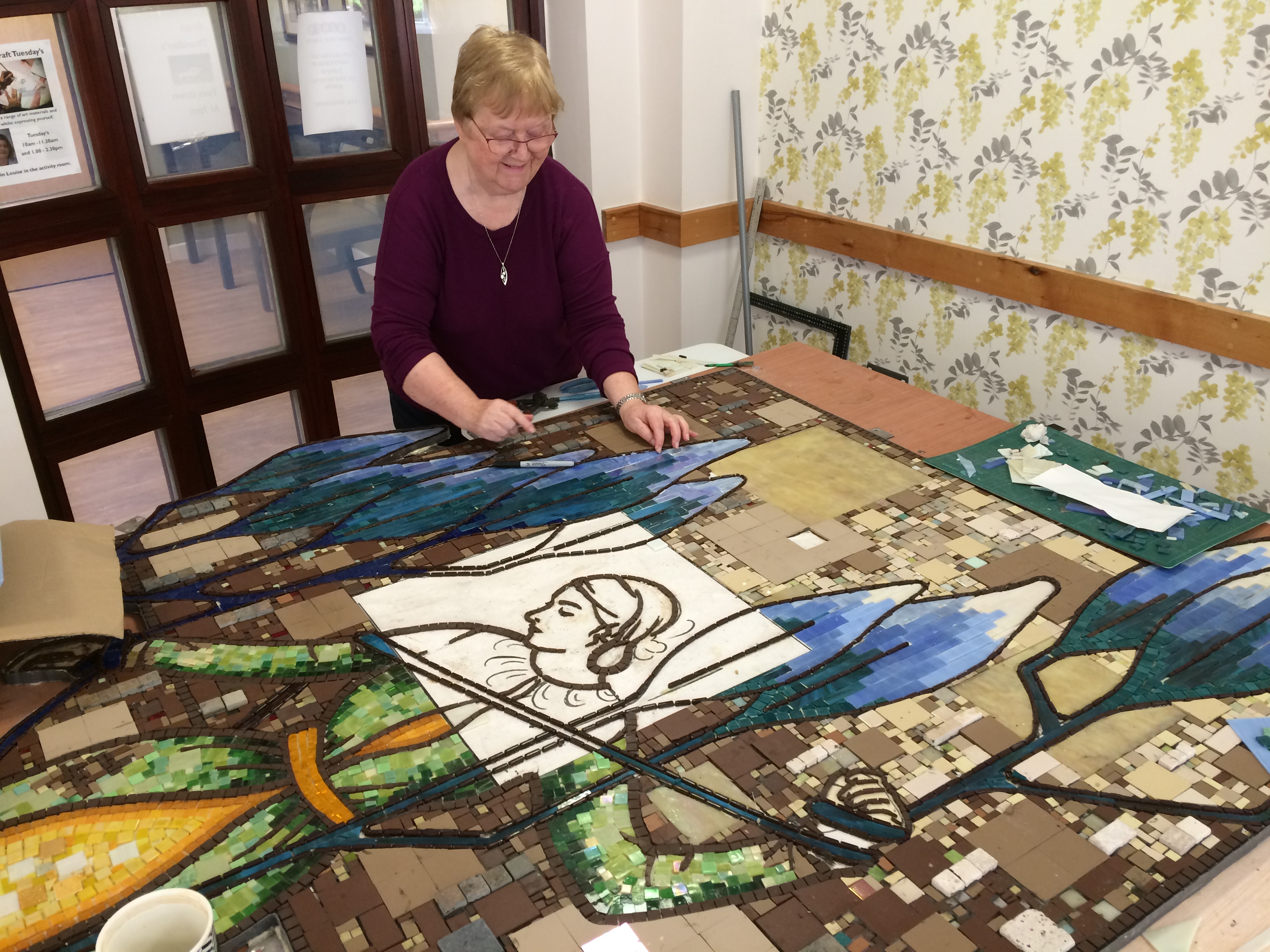 lady making a mosaic