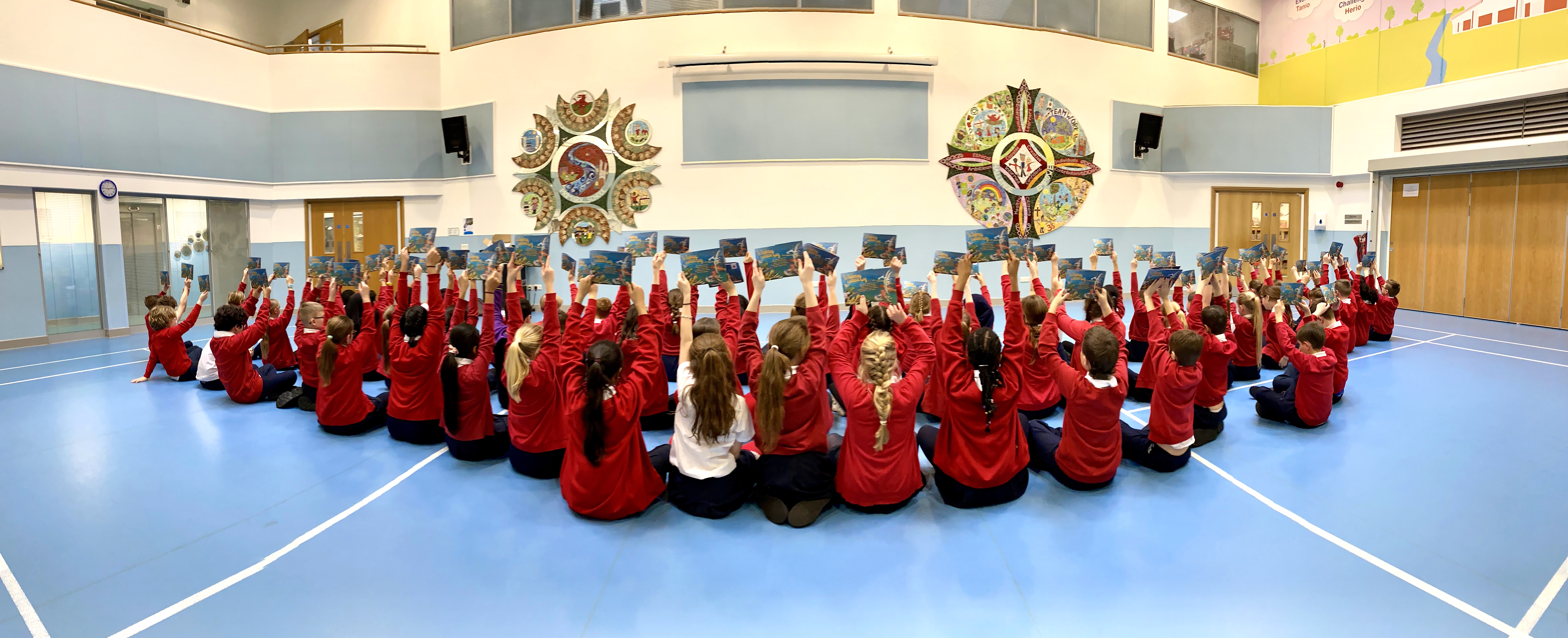 90 children holding a book