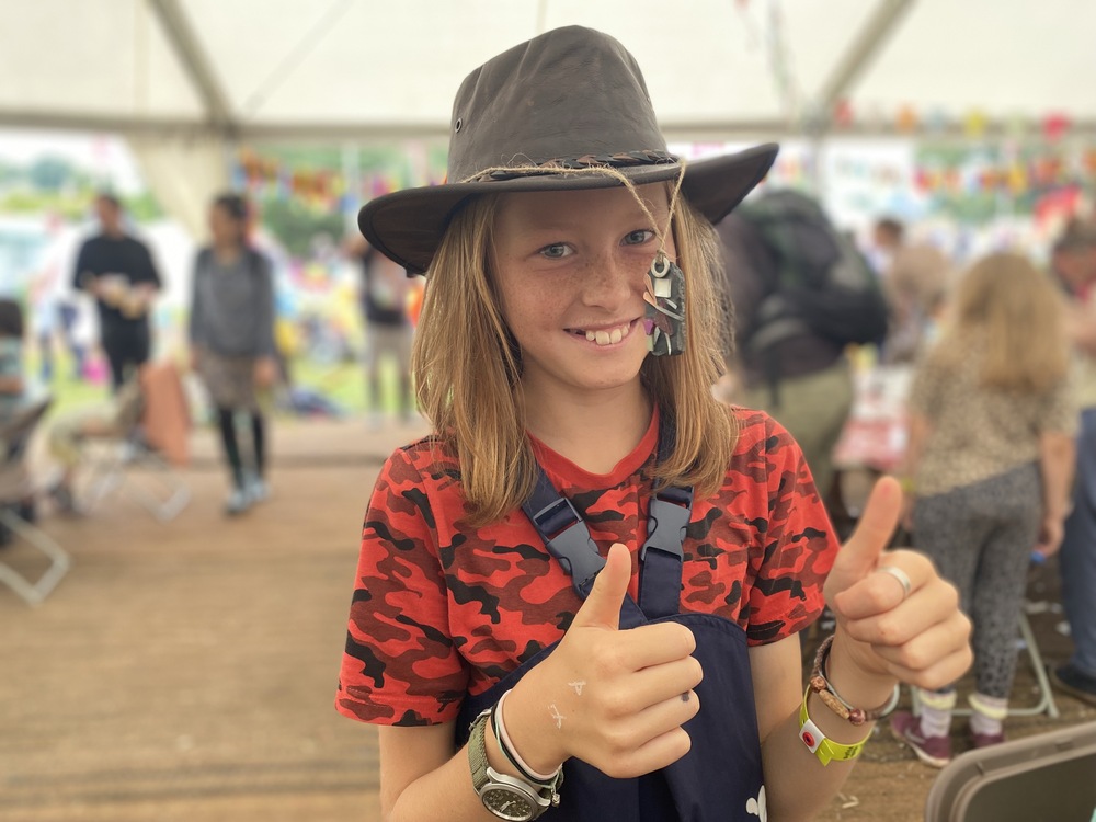 Young girls proud to be hanging her Street Fairy from her hat at a festival