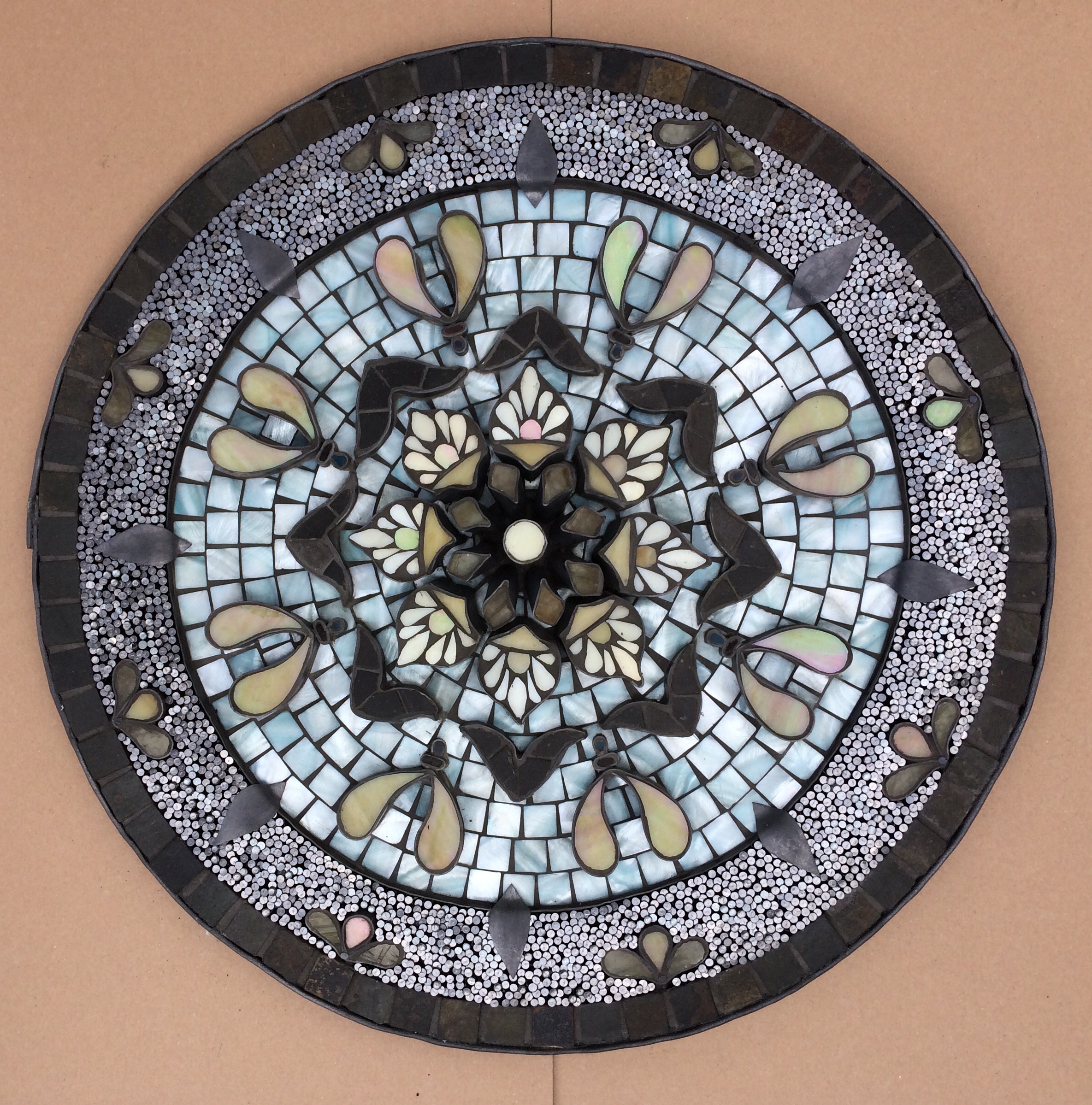 circular mosaic with nails