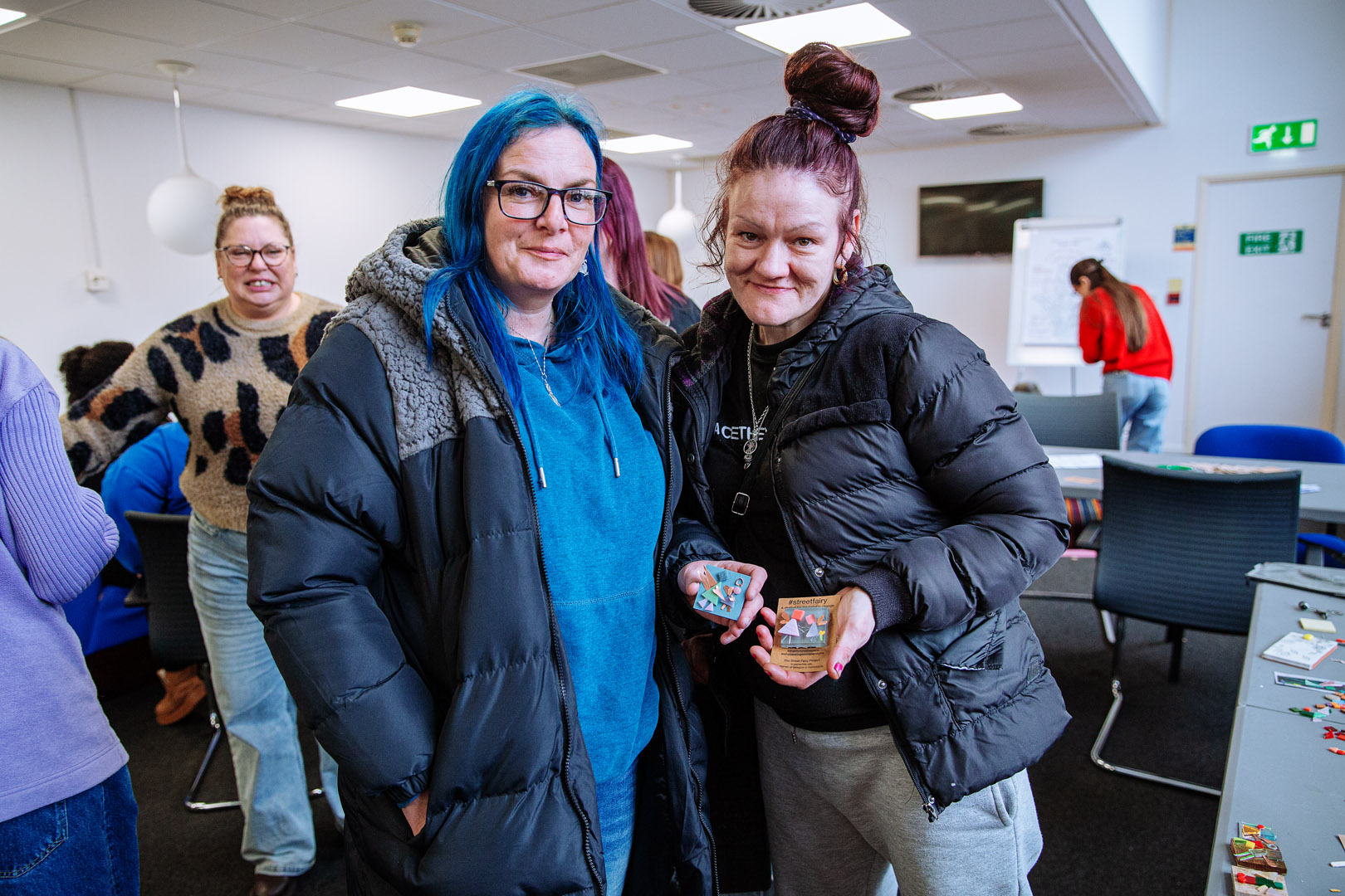 photo of women holding symbols of safety