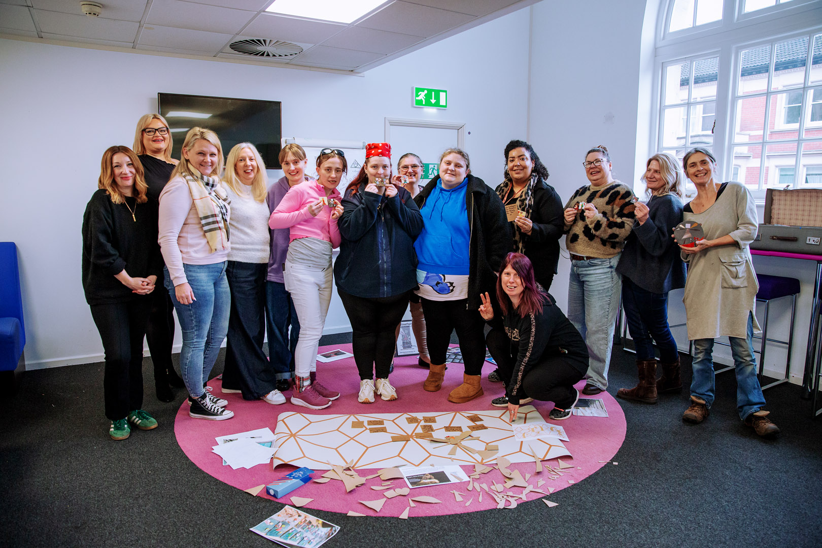 women celebrating their symbols of safety in a photograph