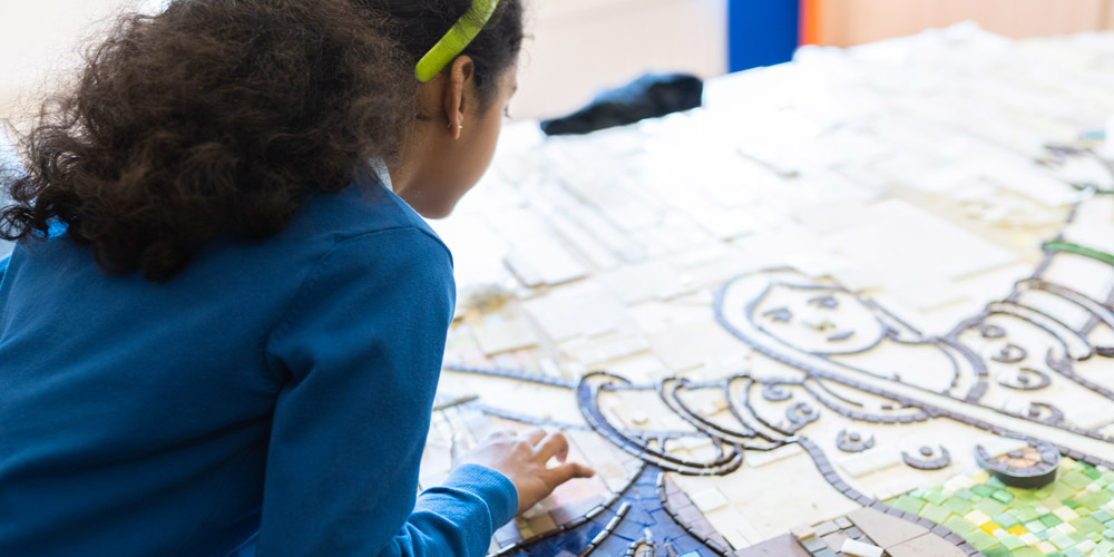 Girl making a mosaIC