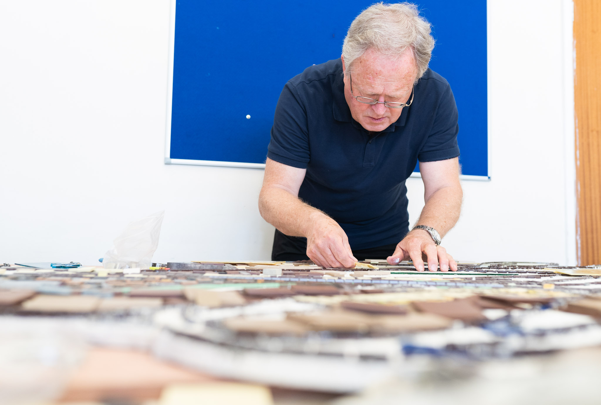 man making a mosaic