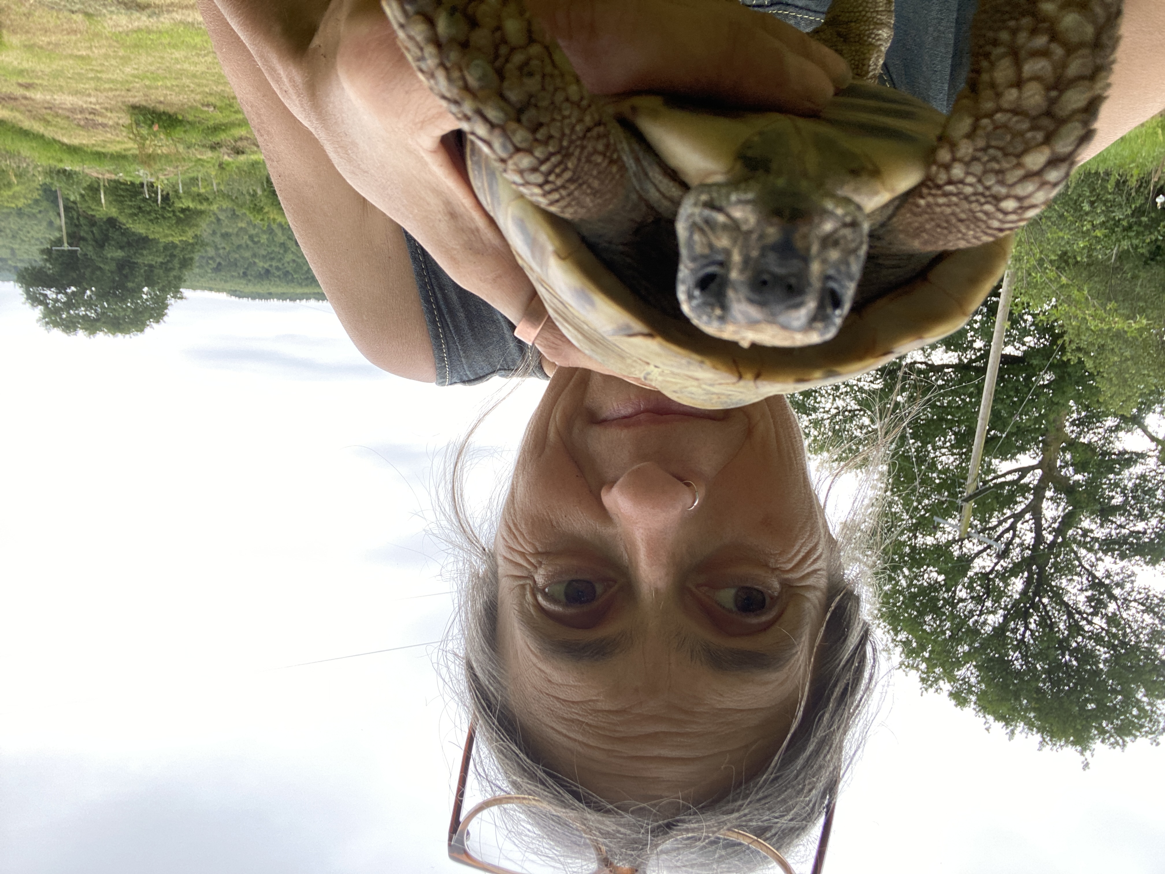 Women holding a tortoise