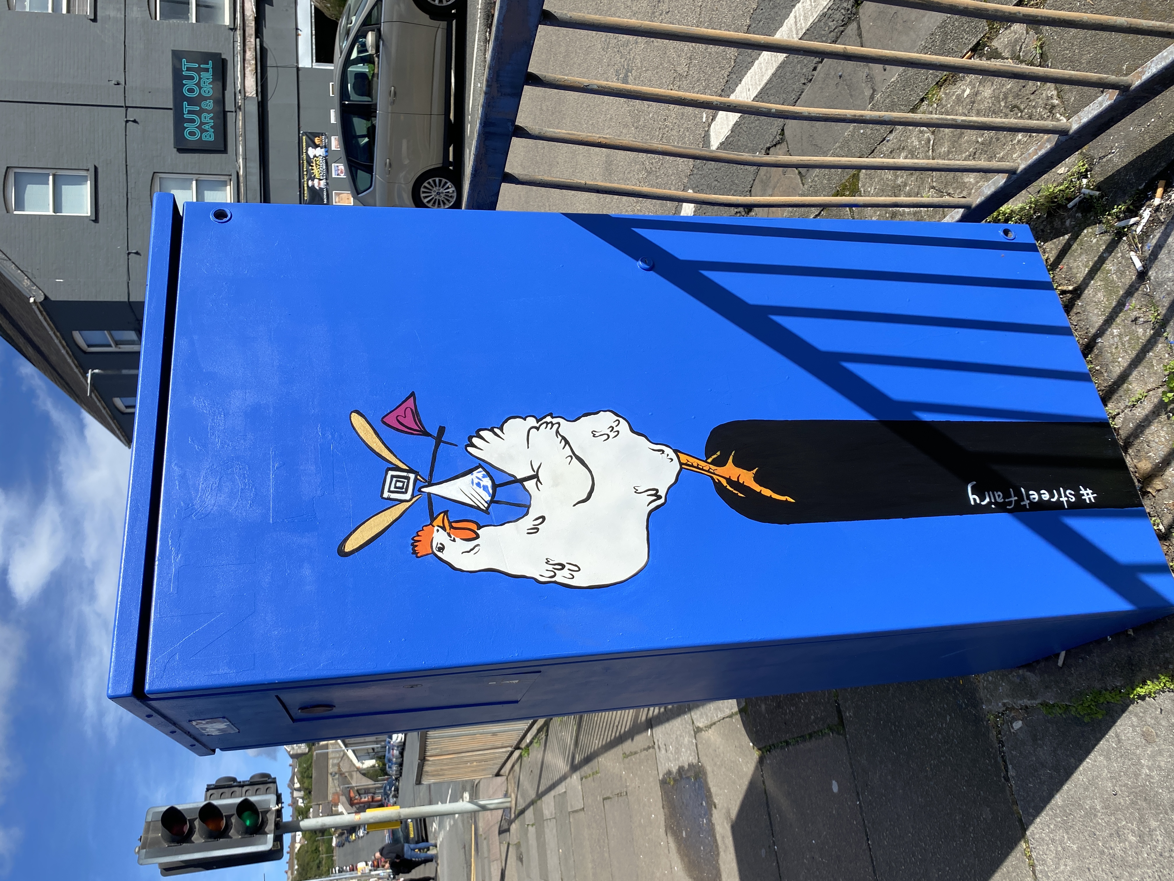 chicken and a #streetfairy painted on a utility box